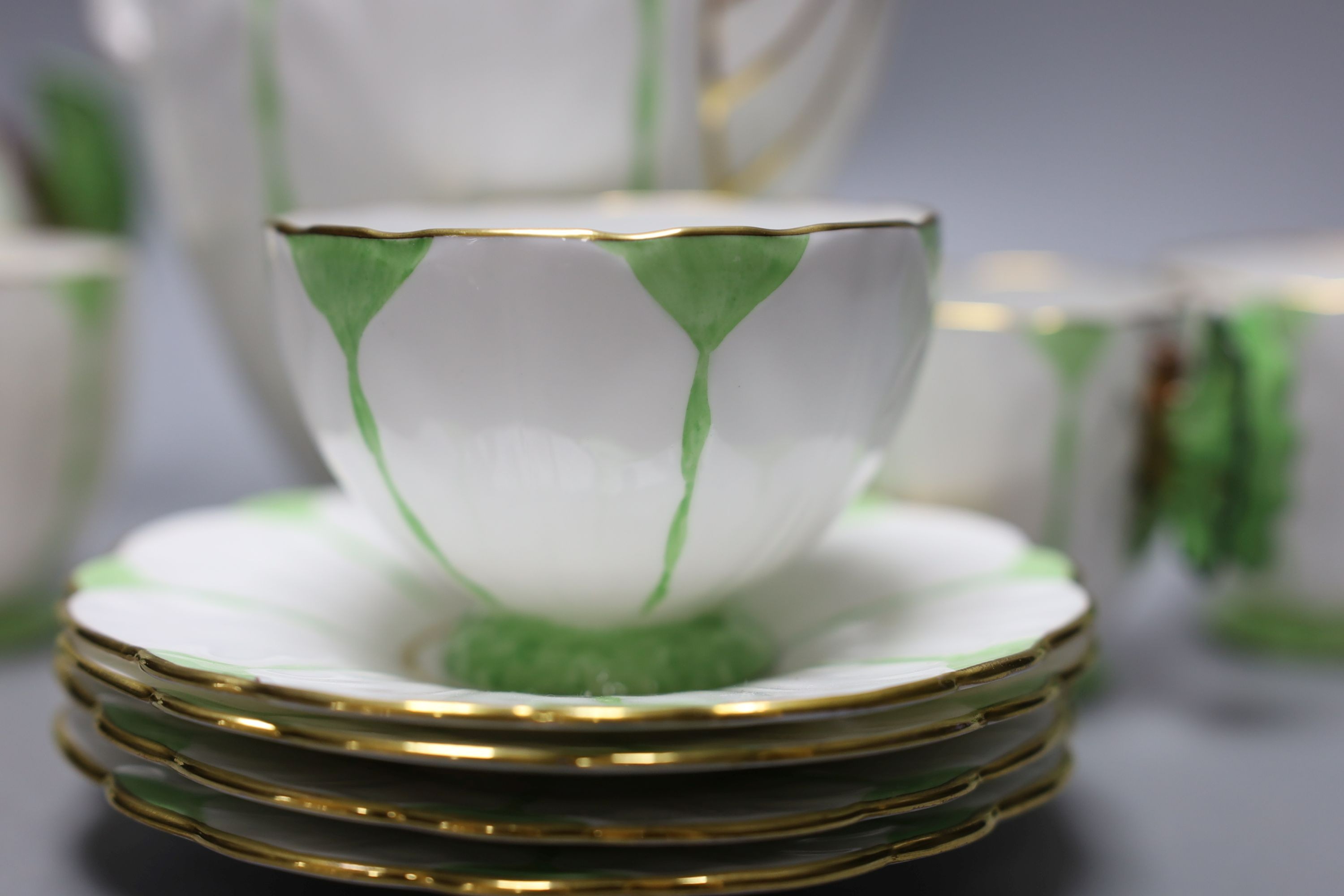 An Aynsley green and white butterfly handled part tea service